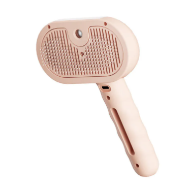 Pink pet grooming brush on a white background