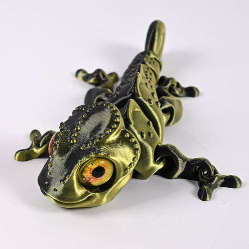 3D-printed articulated chameleon fidget toy with movable limbs and curling tail in vibrant color