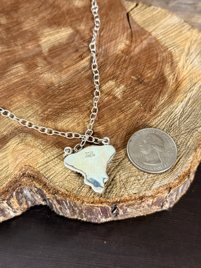 Sterling silver cowhead pendant necklace with rounded silhouette, link chain