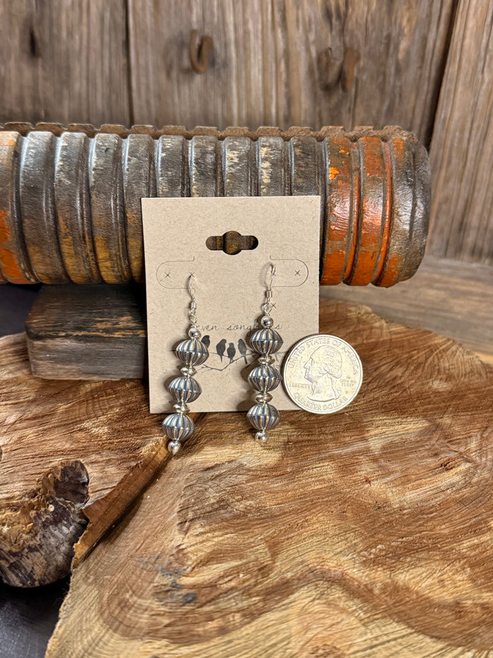 Silver-tone pumpkin bead fishhook earrings, three-tier dangle; coin for scale