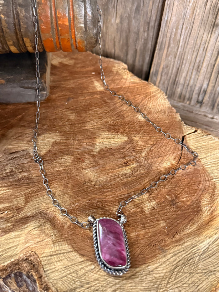 Silver-tone 18-inch necklace with purple spiny oyster oval pendant, close view