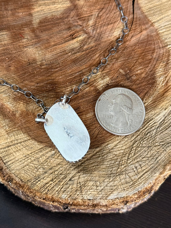 Silver-tone 18-inch necklace with two shell tag pendants; shown with coin