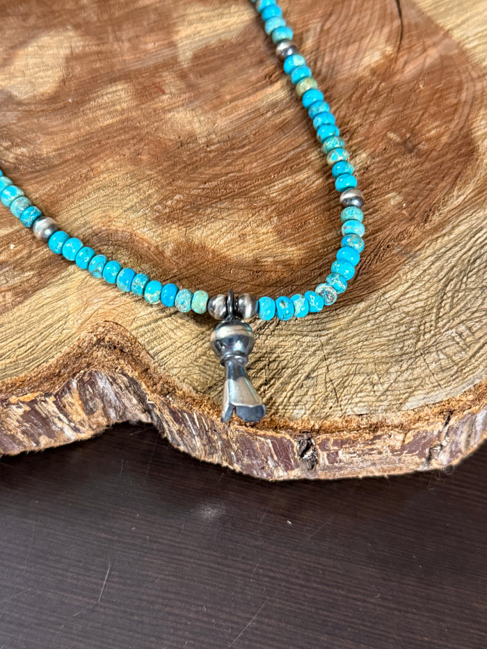 Kingman turquoise beaded necklace with silver blossom pendant and metal spacers
