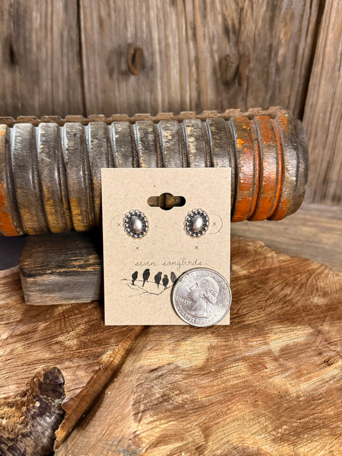 Sterling silver oval concho stud earrings with beaded halo and dark center dots