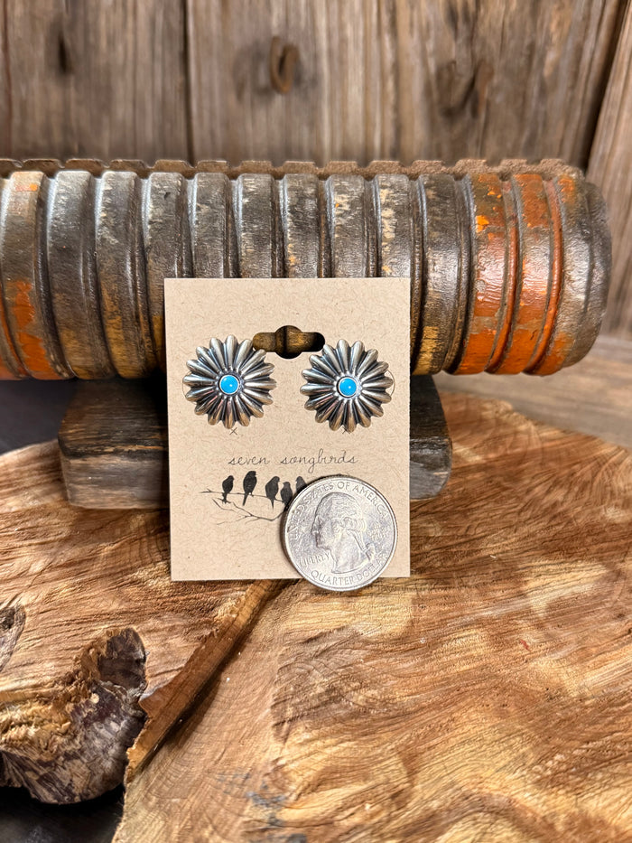 Sterling silver concho stud earrings with turquoise blue center, shown with coin for scale
