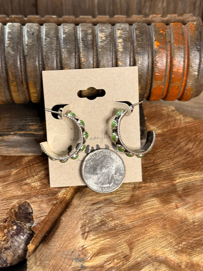Native Made Sonoran Gold hoop stud earrings with green bead trim, shown with coin scale