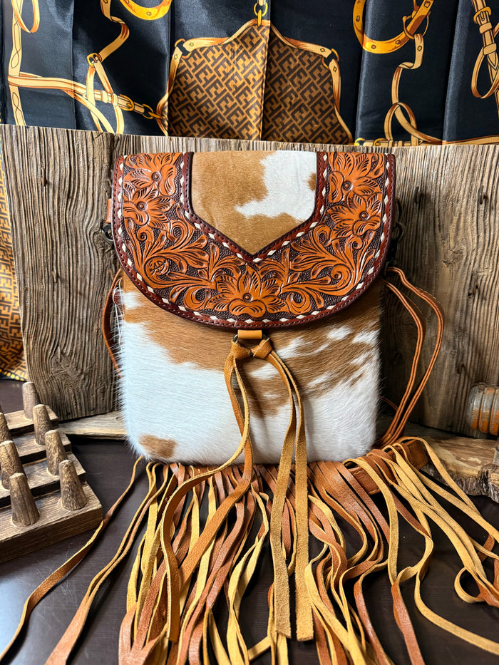 Cowhide fringe crossbody purse with brown-and-white hair-on-hide front panel