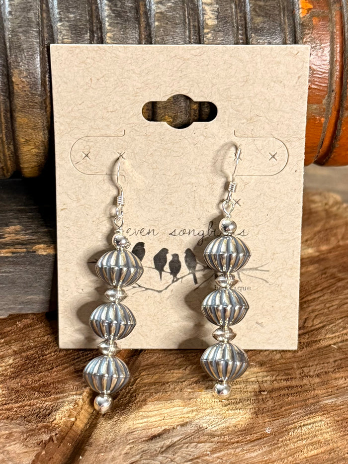 Silver-tone three-tier pumpkin bead fishhook earrings on display card
