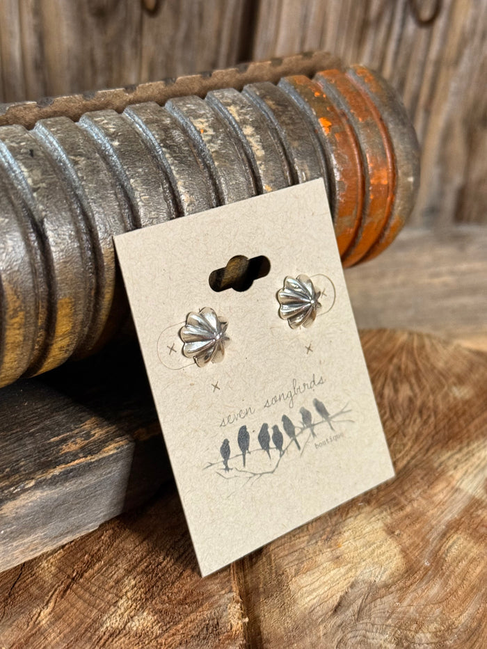Sterling silver stud earrings with two flower starburst charms, shown on card