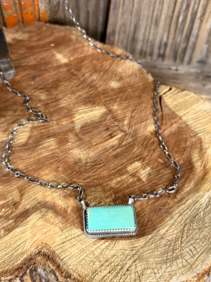 Silver chain necklace with turquoise rectangle pendant, bar-shaped design