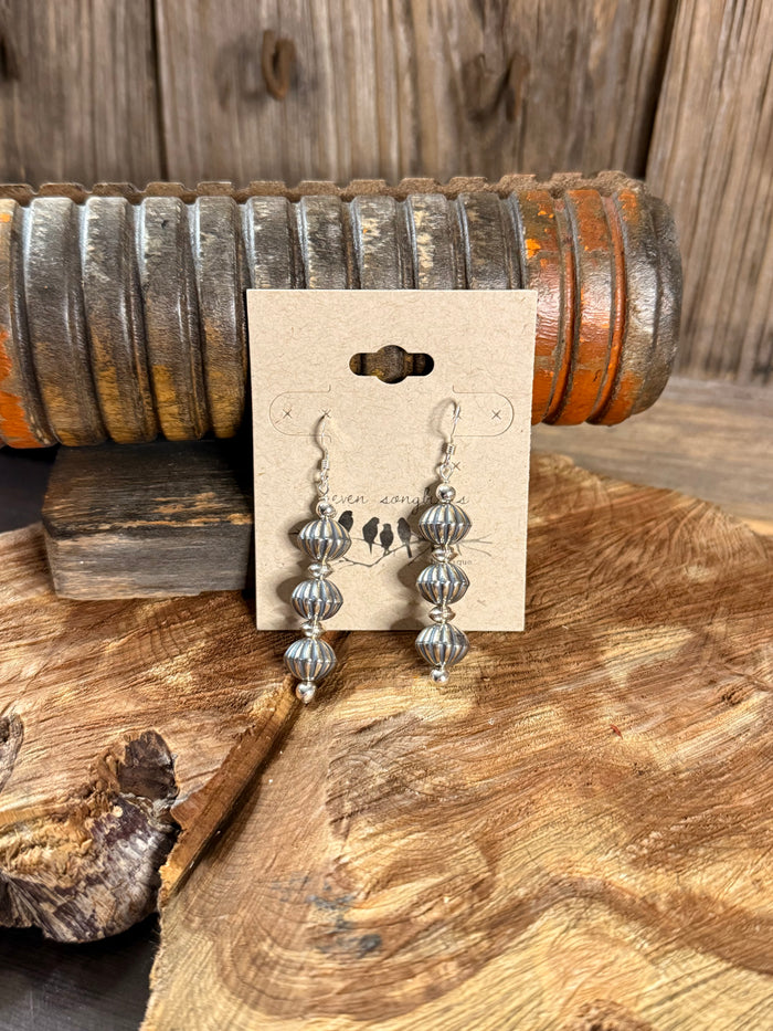 Silver-tone pumpkin bead fishhook earrings, three-tier dangling design