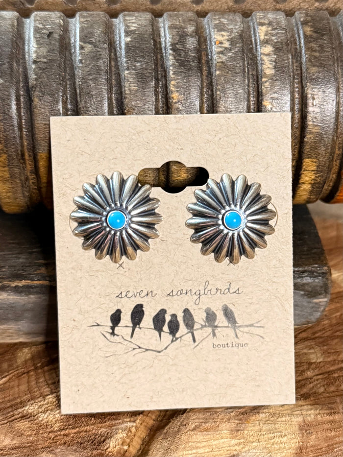 Sterling silver concho stud earrings with turquoise cabochon centers and petal borders