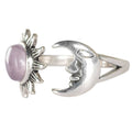 Silver ring with a pink stone on a white background