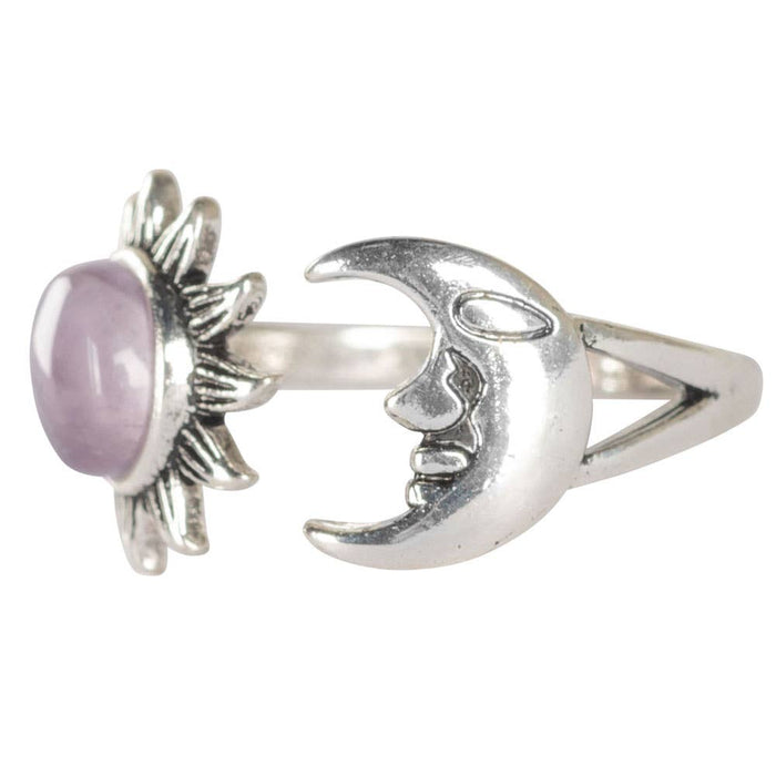 Silver ring with a pink stone on a white background