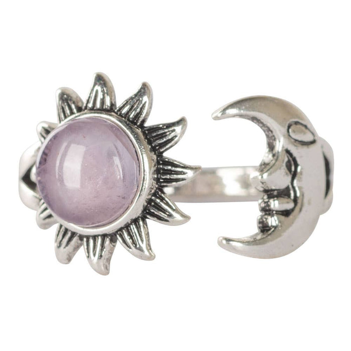 Silver sun and moon ring with a purple gemstone on a white background