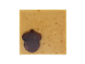 light brown coffee speckled square soap  with dark brown acorn shaped soap on top