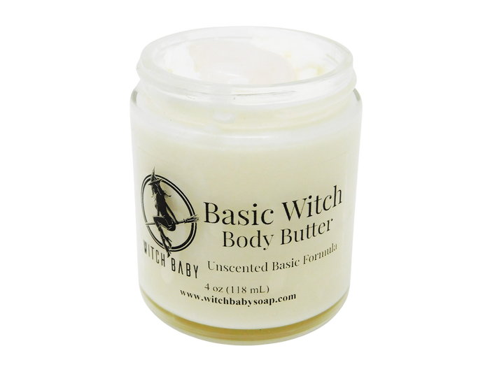4 oz glass jar containing white body butter topped with milk quartz. Label says unscented basic formula.
