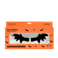 Packaging of 'Bat Habits' detox undereye masks with charcoal, tremella mushroom, and niacinamide. The package contains 4 pairs of masks in the shape of bats, displayed on an orange background with bats graphics around.
