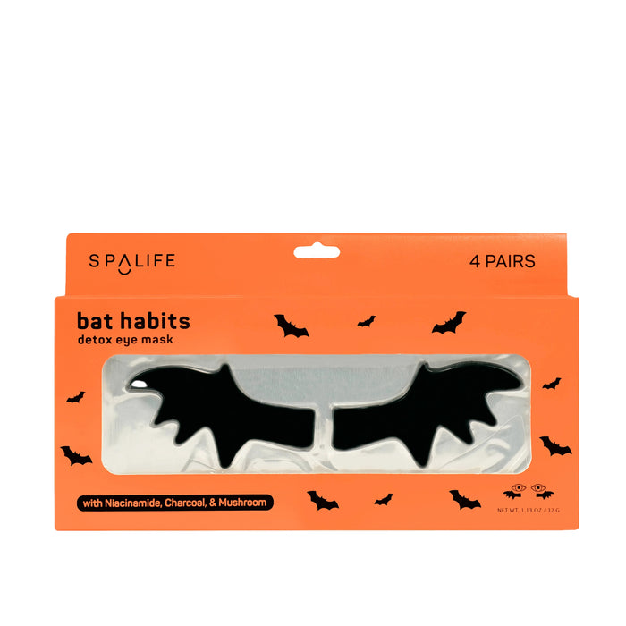 Packaging of 'Bat Habits' detox undereye masks with charcoal, tremella mushroom, and niacinamide. The package contains 4 pairs of masks in the shape of bats, displayed on an orange background with bats graphics around.
