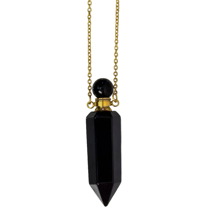 Black pendant necklace with gold chain on a white background