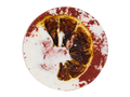 circular half red and white blood spatter appearance bath bomb with a blood orange pressed on top