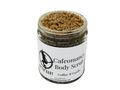 9 oz glass jar containing coffee scrub. Dark brown in color. label says cafeomancy body scrub coffee and vanilla.