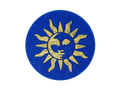 navy blue circular bath bomb with 90s style whimsigothic gold sun air brushed on top