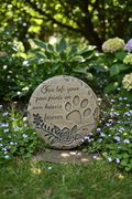 Rose pet memorial stone in peaceful garden setting