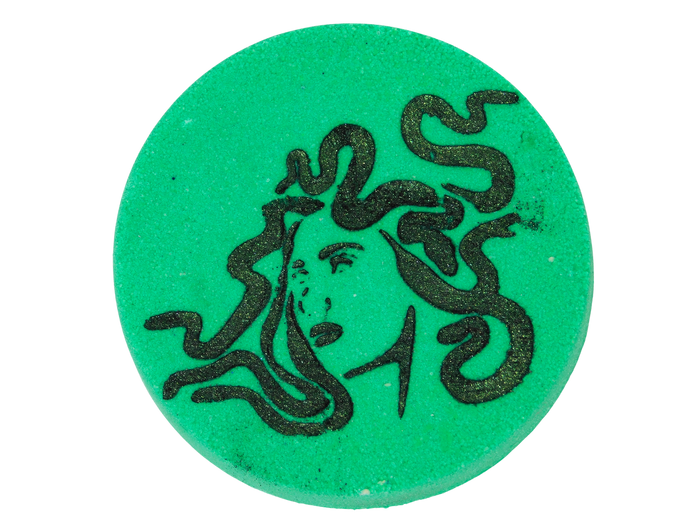 Green circular object with medusa airbrush on a white background