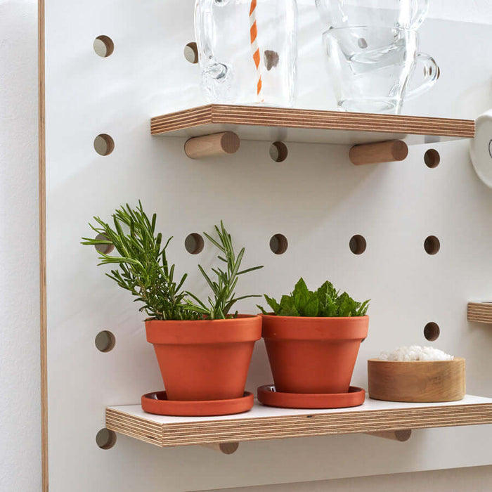 white wooden shelf for pegboard