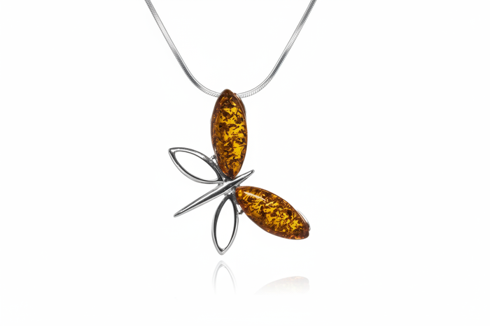 Sterling silver dragonfly pendant necklace with two elongated honey amber wing stones on a snake chain, white background