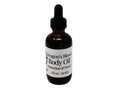 2 oz glass dropper bottle in amber color with label that says dragons blood body oil. Protection and power.