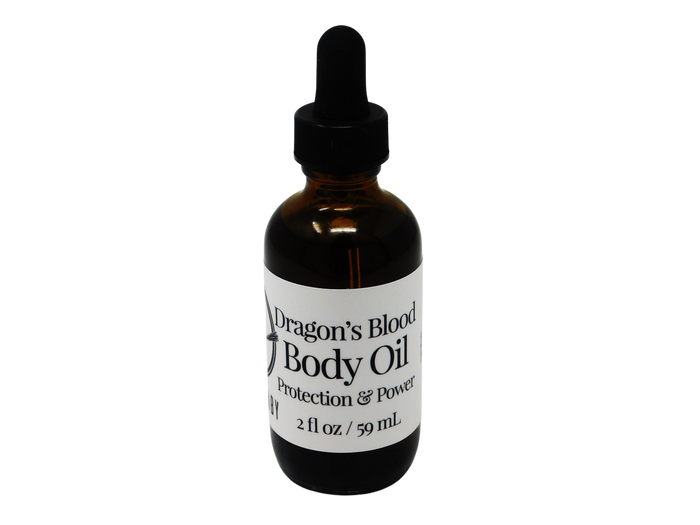 2 oz glass dropper bottle in amber color with label that says dragons blood body oil. Protection and power.
