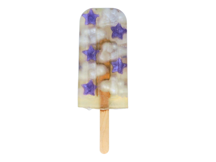 Popsicle shaped soap with purple stars and clouds on a white background