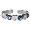 Silver ring with heart and eye-shaped stones on a white background