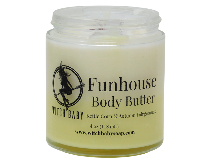 A jar of Witch Baby Funhouse Body Butter with a clear label featuring black text and a witch silhouette logo, set against a plain white background.