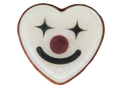 A heart-shaped white soapwith a black smiley clown face, star eyes, and a red nose, isolated on a white background.