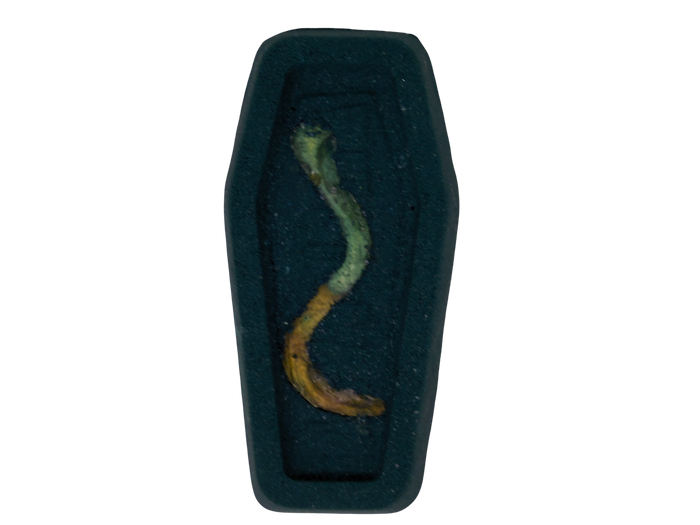 black coffin bath bomb with embedded soapy gummy worm