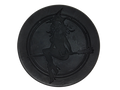 Circular black soap with witch baby logo on top