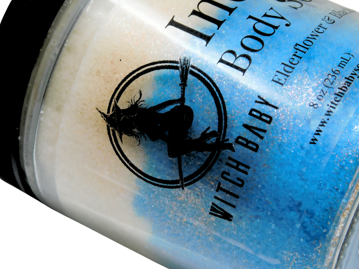jar of 'Witch Baby' body scrub with branding and closed up of glitter