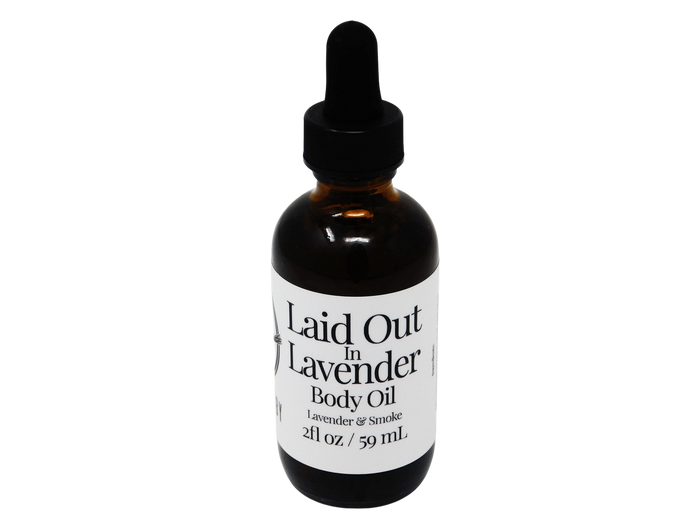 2 oz glass dropper amber in color. label says laid out in lavender body oil. Lavender and Smoke