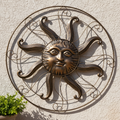 36" Sun Wall Decor on Stucco with Greenery