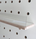 white wooden shelf for pegboard with clear front