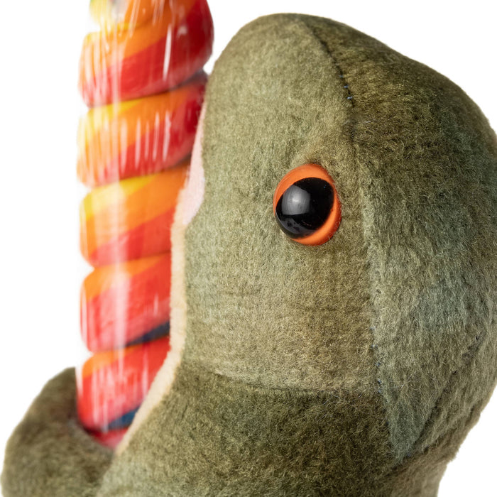 Close-up of green Lollyplush T Rex dinosaur plush face showing ultra-soft olive fur texture and glossy orange-rimmed eye detail