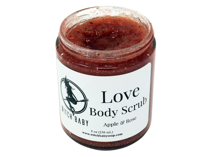 8oz glass jar containing red colored scrub with small black seed. Label says Love body scrub apple and rose.