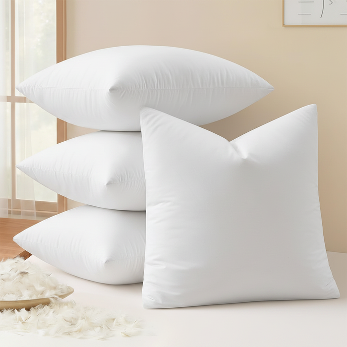 Luxury 16x16 white goose feather down pillow inserts stacked on a warm ivory background – clean product shot