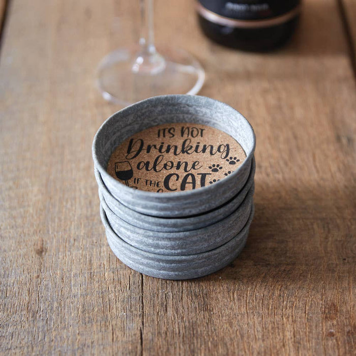 Cat Is Home mason jar lid coaster set displayed on a table – 4 cork-lined coasters with charming cat-themed print, arrives gift-ready with jute ribbon tie