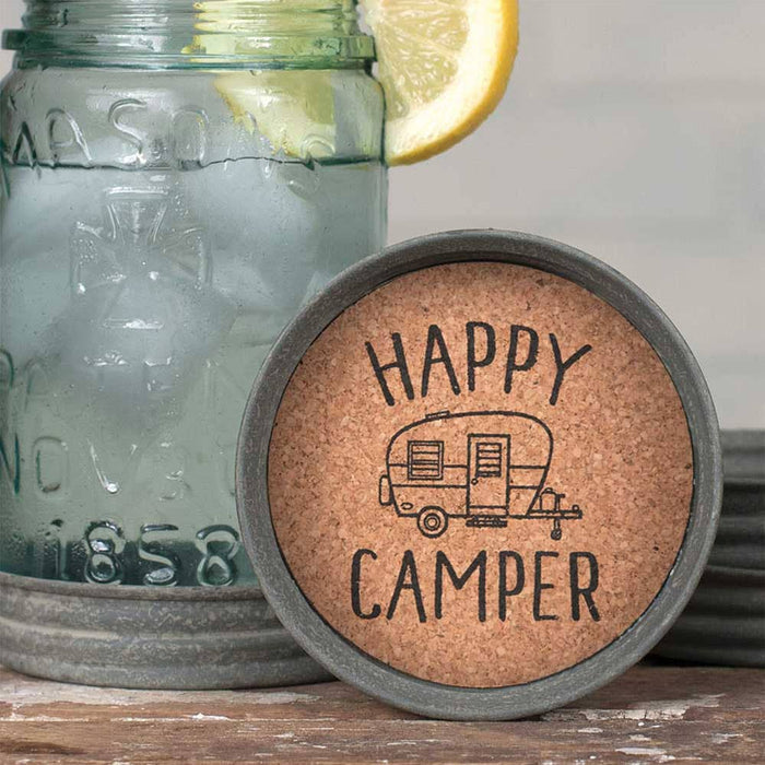 Set of 4 Happy Camper mason jar lid coasters with waterproof print and cork lining, shown from above – rustic outdoor-themed drink coasters, 3¾ inch diameter