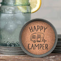 Set of 4 Happy Camper mason jar lid coasters with waterproof print and cork lining, shown from above – rustic outdoor-themed drink coasters, 3¾ inch diameter
