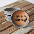 Set of 4 Sip Sip Hurray mason jar lid coasters with waterproof print and cork lining, tied with jute ribbon – festive rustic drink coasters, 3¾ inch diameter, fits wide-mouth Mason jars